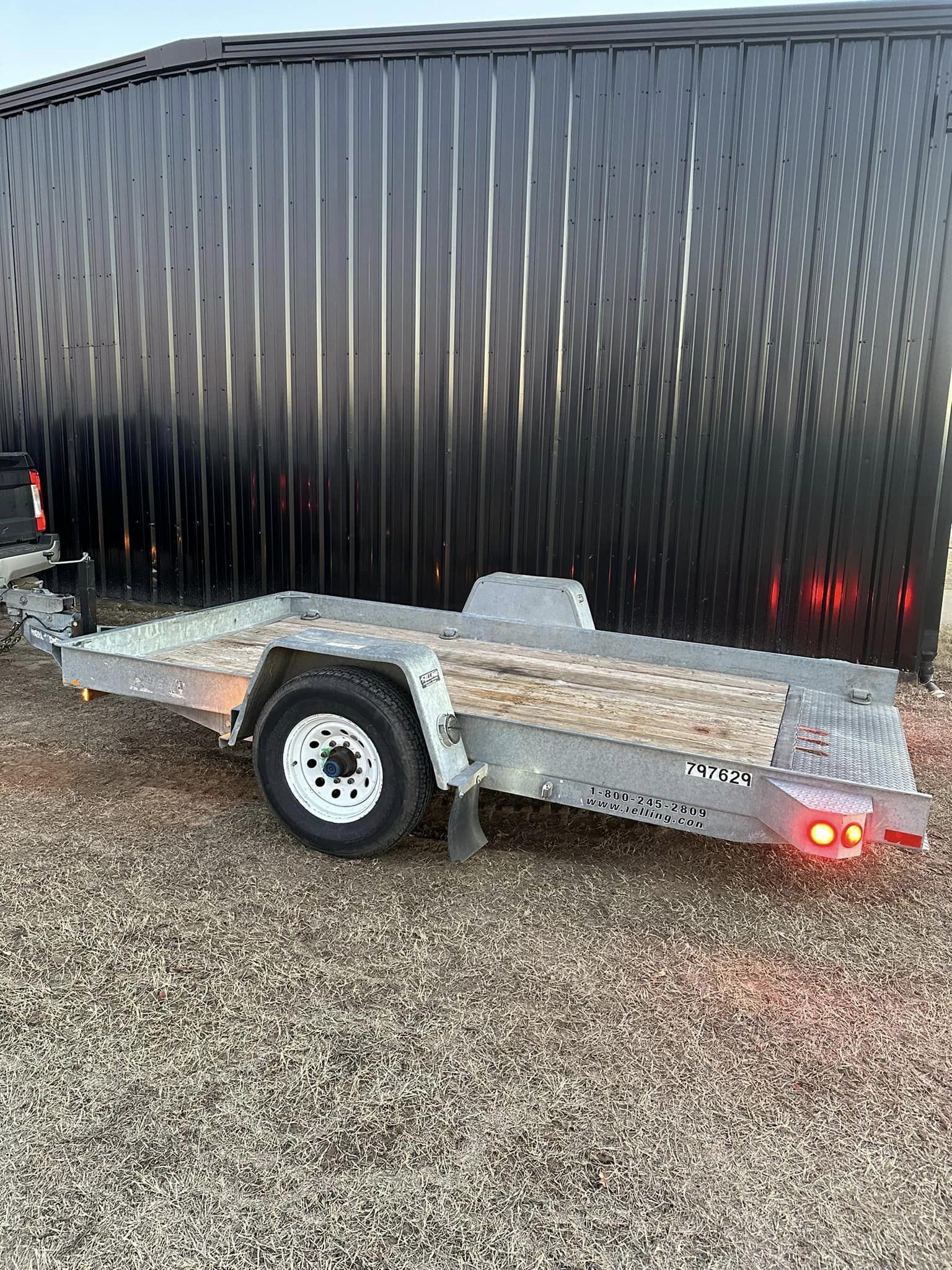 SOLD-12’ Felling commercial Tilt deck trailer.