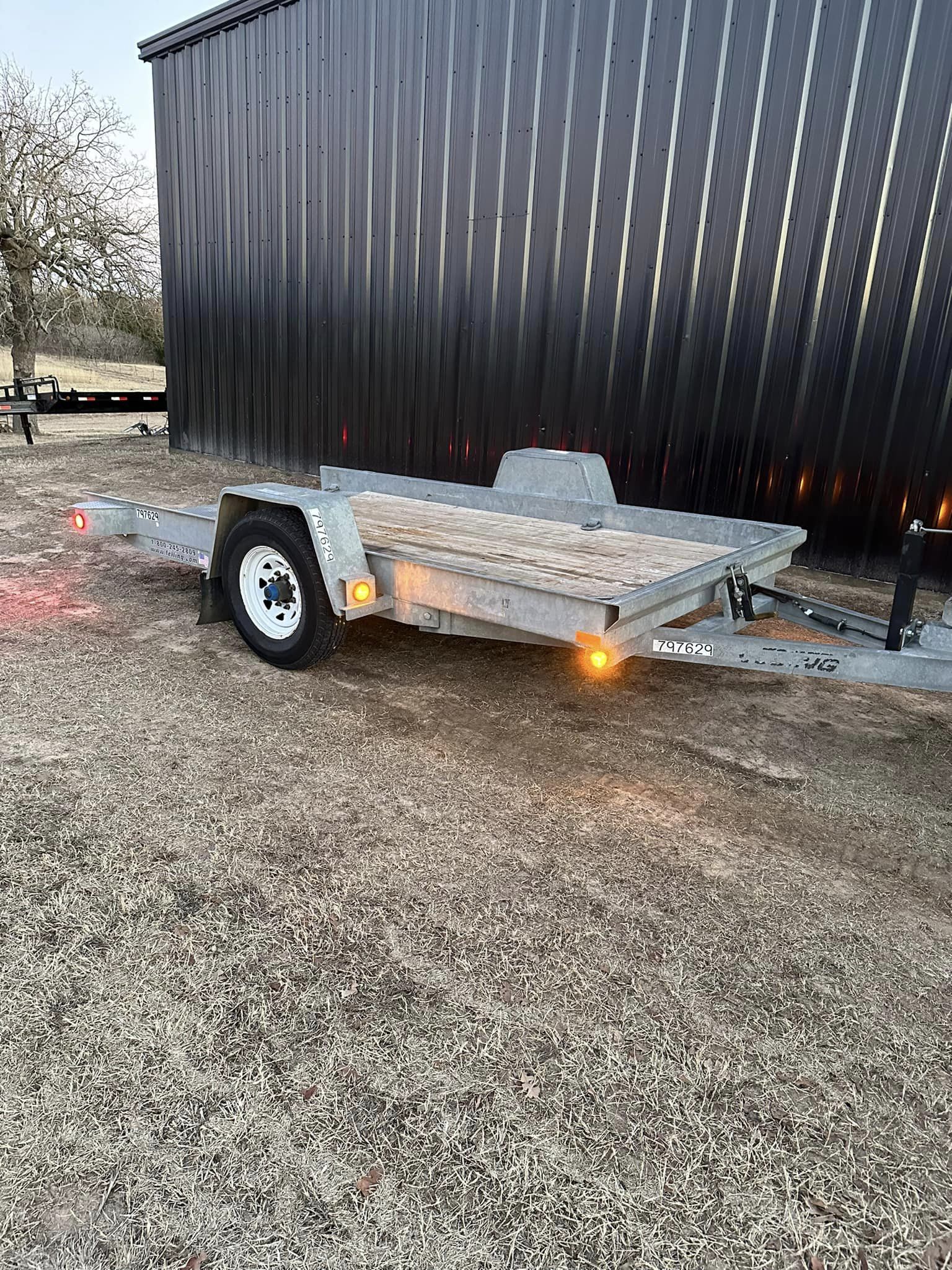 SOLD-12’ Felling commercial Tilt deck trailer.