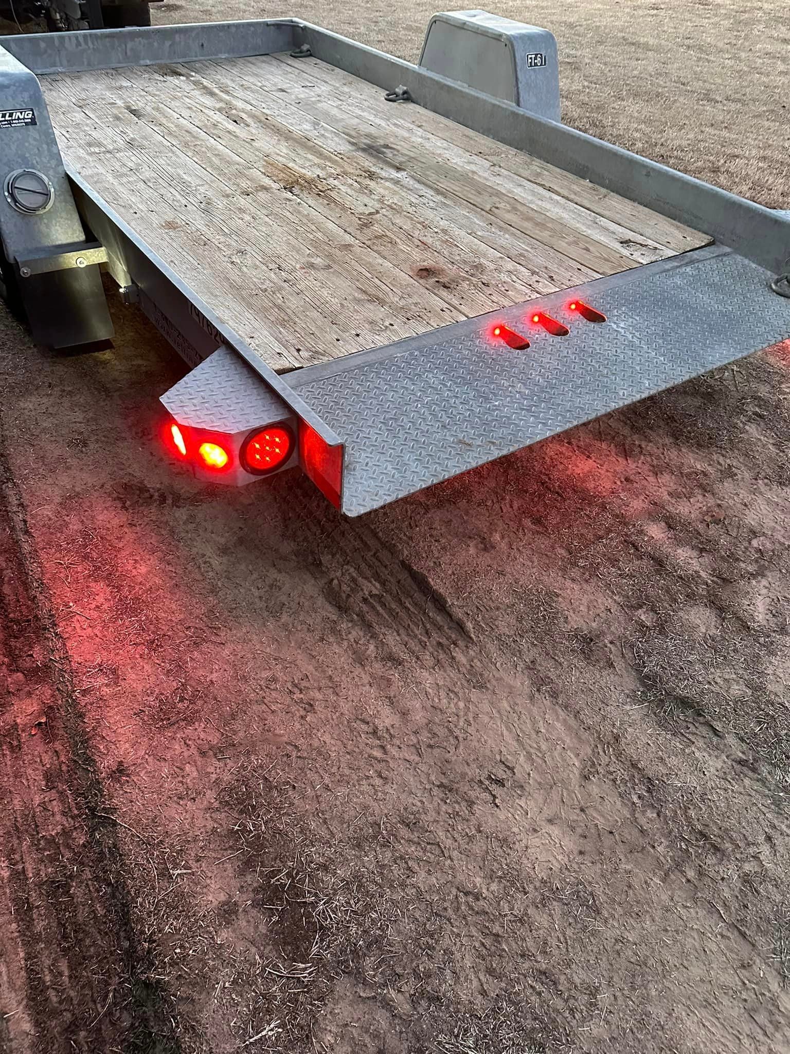 SOLD-12’ Felling commercial Tilt deck trailer.